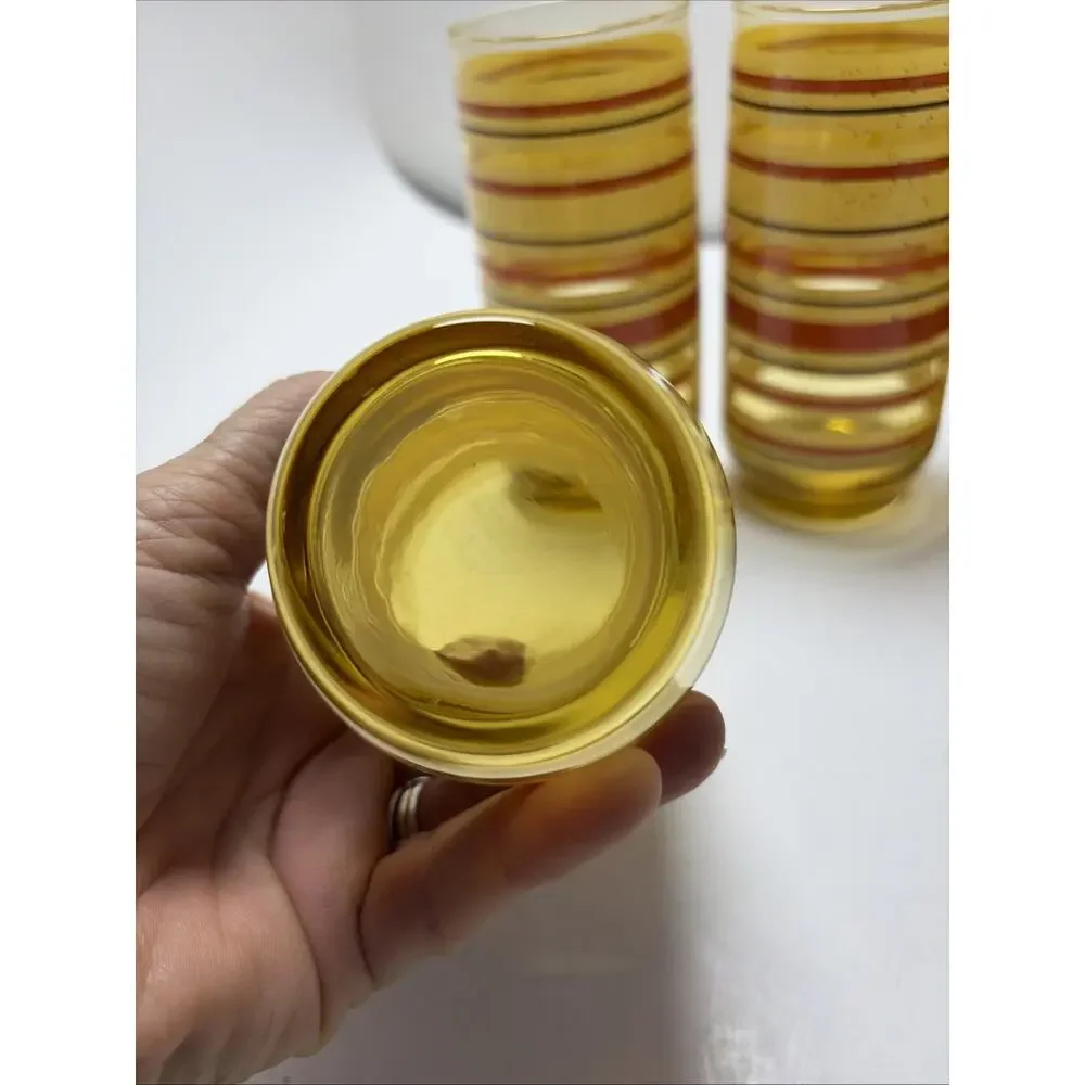 Mid Century Modern amber glass juice tumblers yellow red stripe speckled Anchor